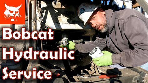 Hydraulic oil fill (access at the side of the machine). . Bobcat 753 hydraulic oil change